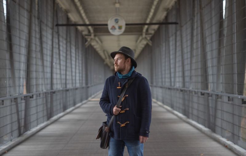 Full length of man standing on bridge