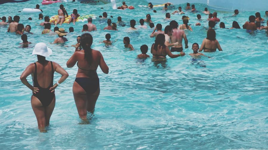 People enjoying in swimming pool