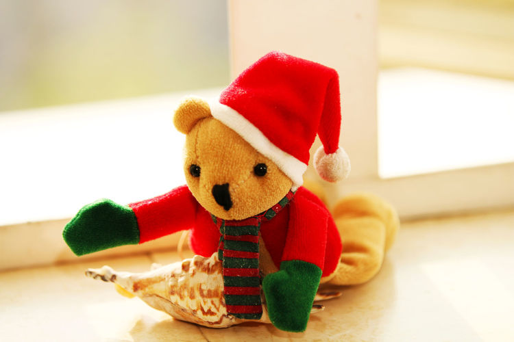 A christmas doll lying on the window sill