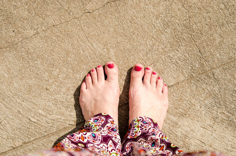 Low section of women with painted toenail
