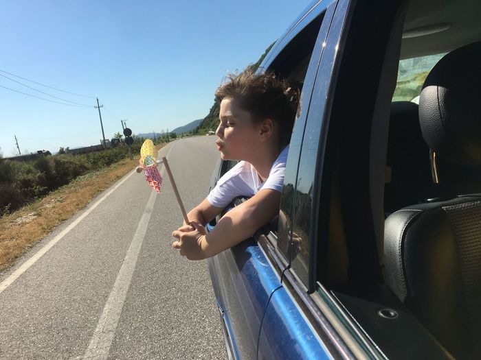 Boy sitting on road