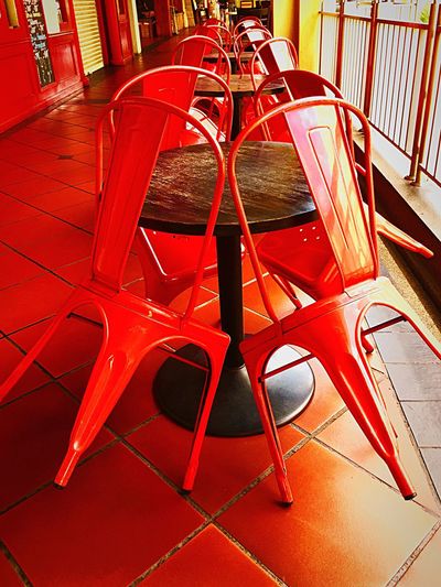 Close-up view of red chairs