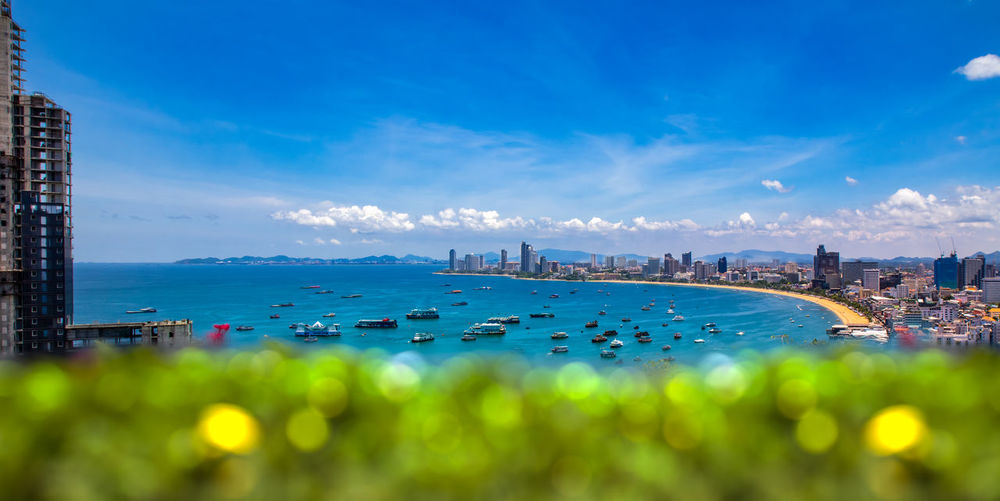 Panoramic view of sea against buildings in city