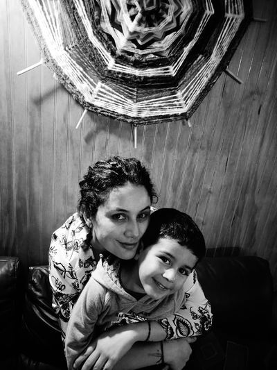 High angle view of portrait mother with son at home