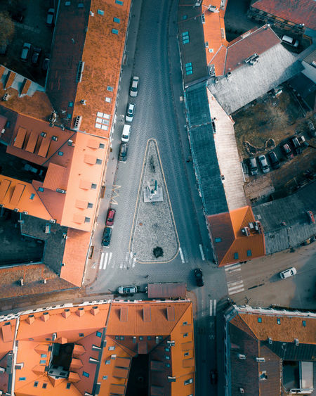 Aerial view of road by houses in town