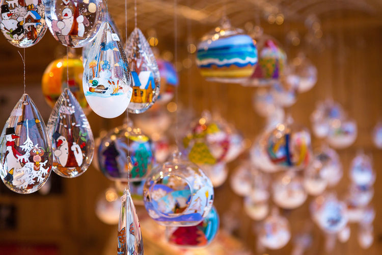 Christmas souvenirs on the counter in europe, painted glass christmas balls with fairy tales.