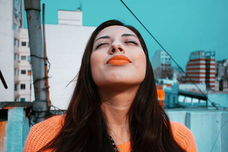 Close-up of beautiful woman with eyes closed