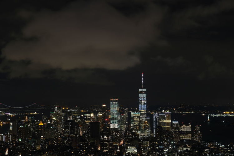 Aerial view of city lit up at night