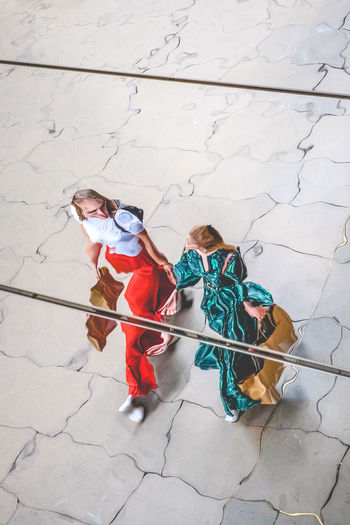 High angle view of people on tiled floor