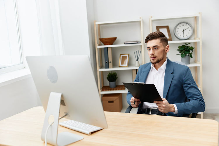 Businessman talking on video conference at office