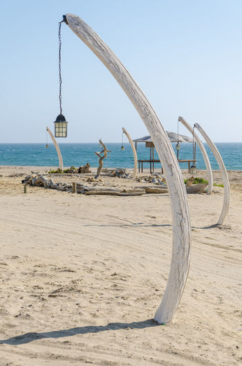 Lamps made of whale bones at beach against clear sky, angola, africa