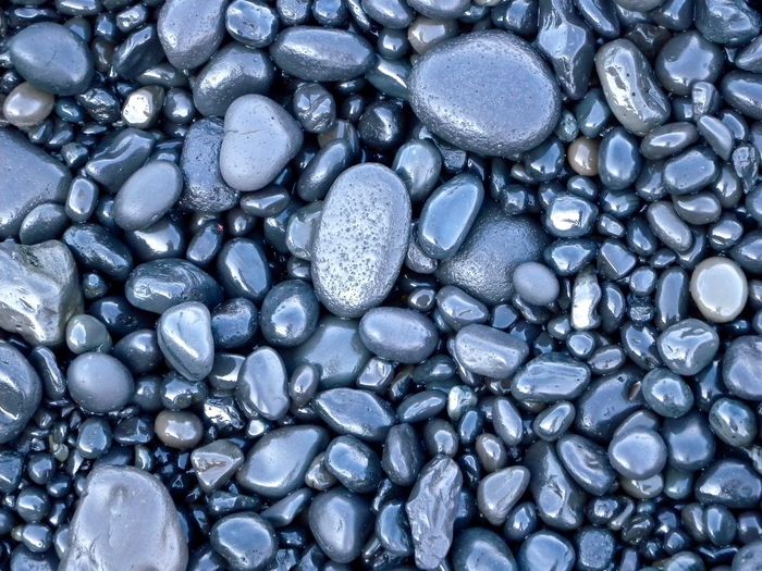 Full frame of wet pebbles