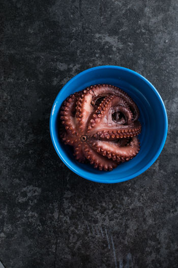 Octopus is boiled in a pot.