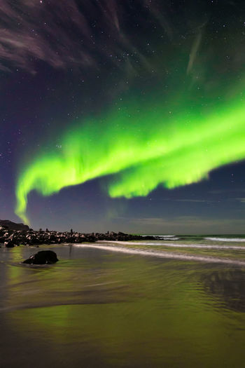 Scenic view of sea against sky at night