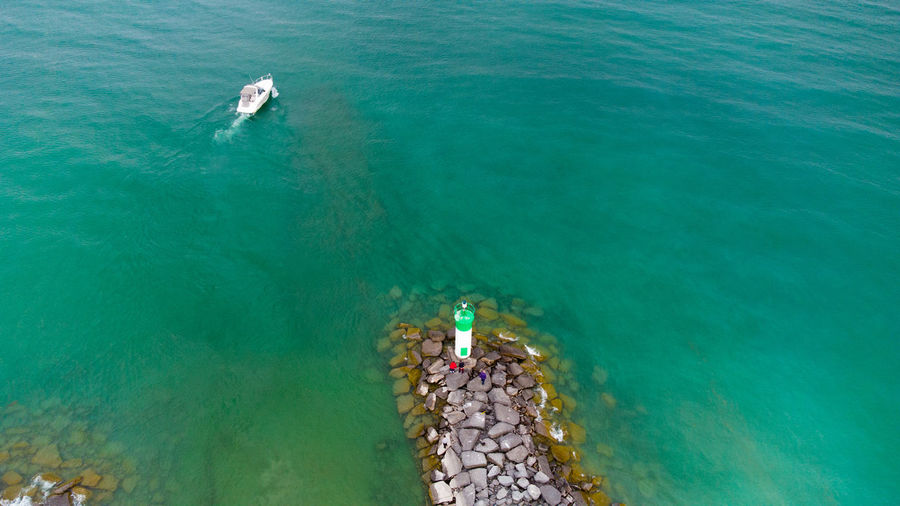 High angle view of people swimming in sea