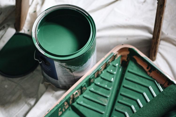 High angle view of green paint can at home