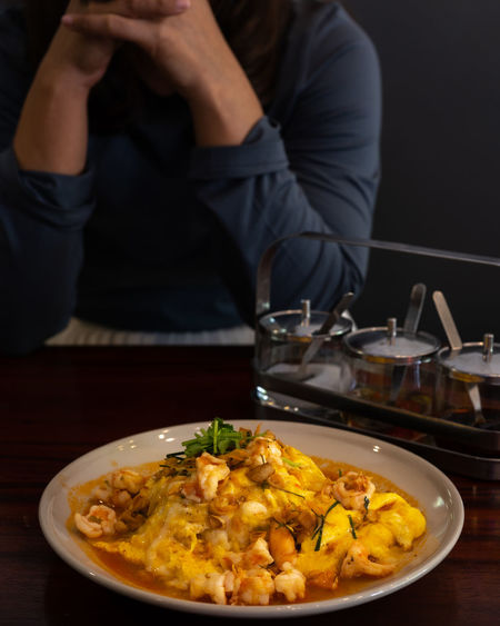 Midsection of man having food in plate
