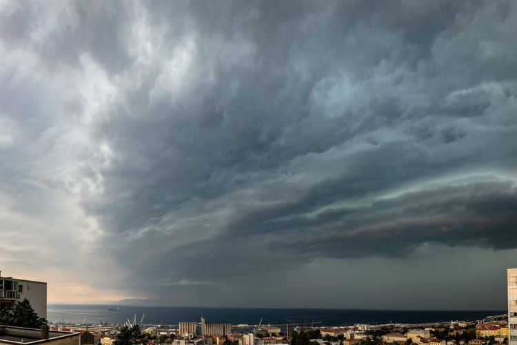Storm clouds over city buildings