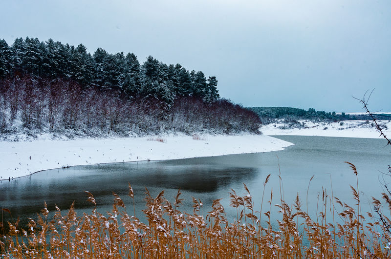 Scenic view of sea against sky during winter