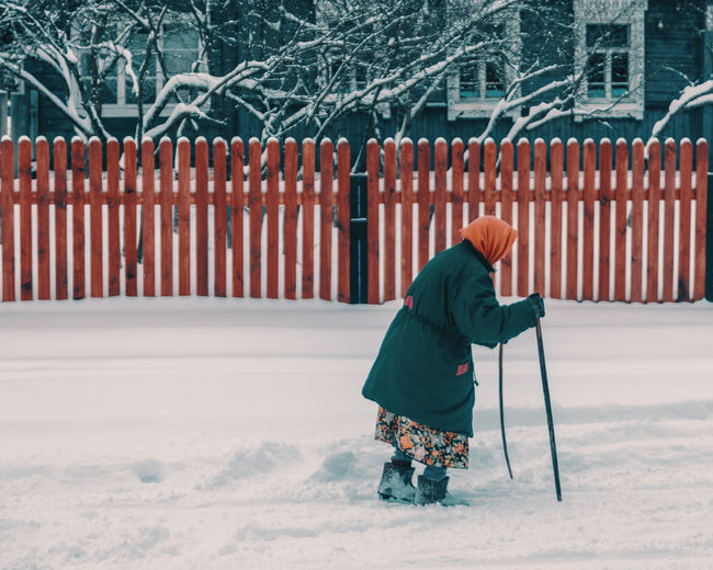 Full length of woman walking on snow
