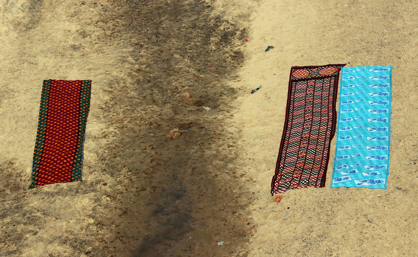 Close-up of towels on sand