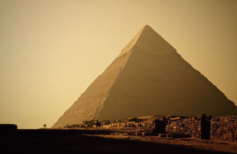 Great pyramid of giza against clear sky on sunny day