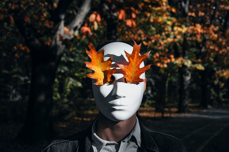 Person wearing mask with maple leaf