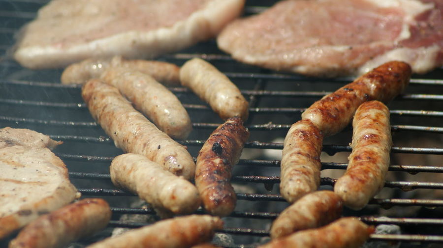 High angle view of meat on barbecue grill