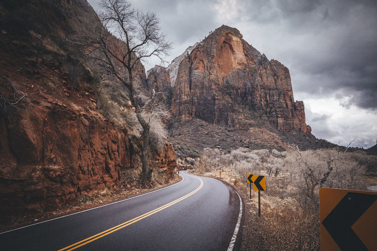 A road between mountains in zion national park, utah