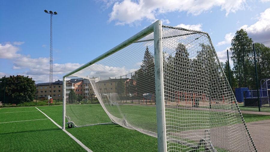 Low angle view of soccer field against sky