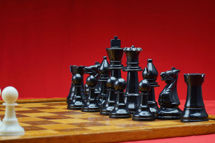 Close-up of chess pieces on table