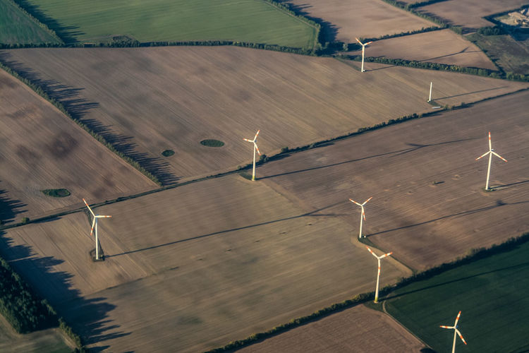 Aerial view of windmills on landscape