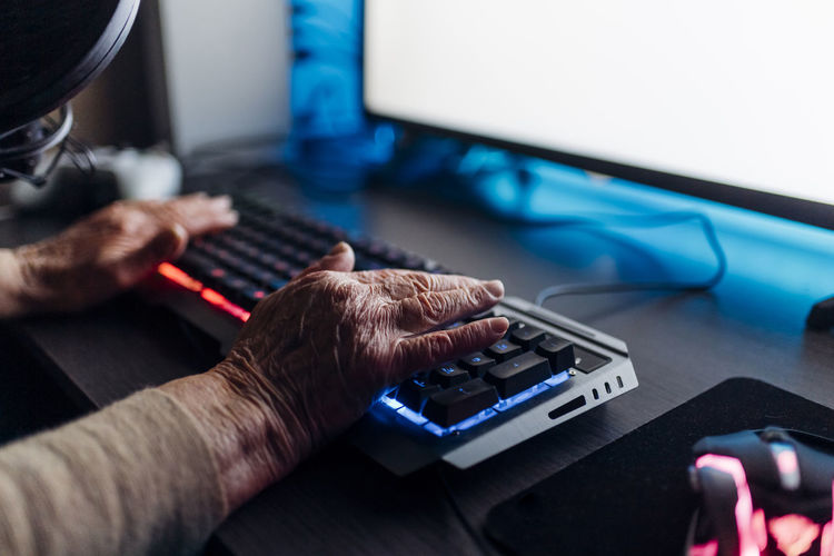Senior woman using computer at home