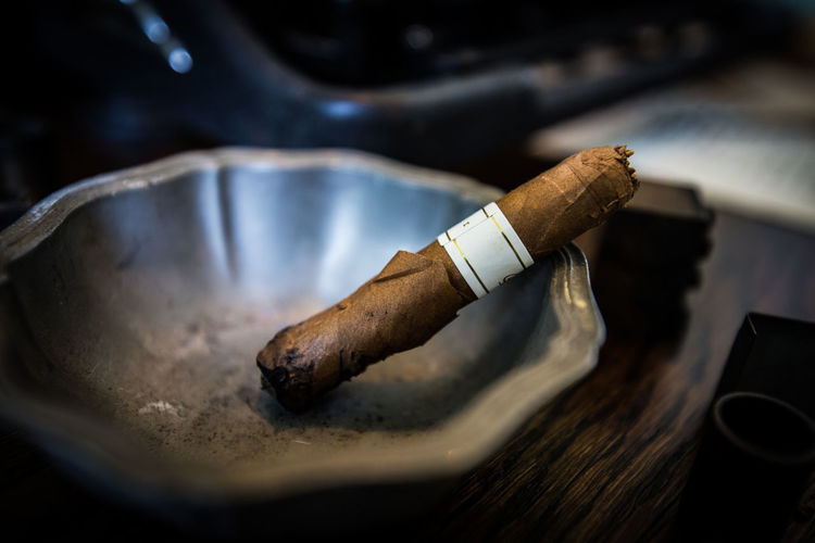 Close-up of cigar in ashtray