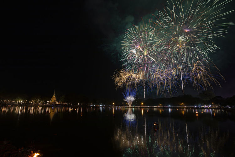 Beautiful fireworks in loi krathong festival at sukhothai historical park thailand.