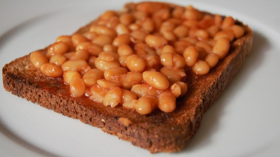 Close-up of baked beans on toasted bread in plate