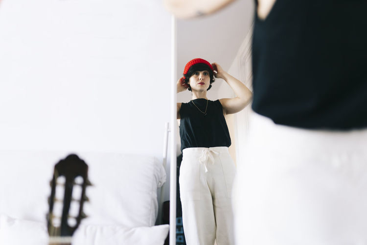 Woman wearing knit hat in studio