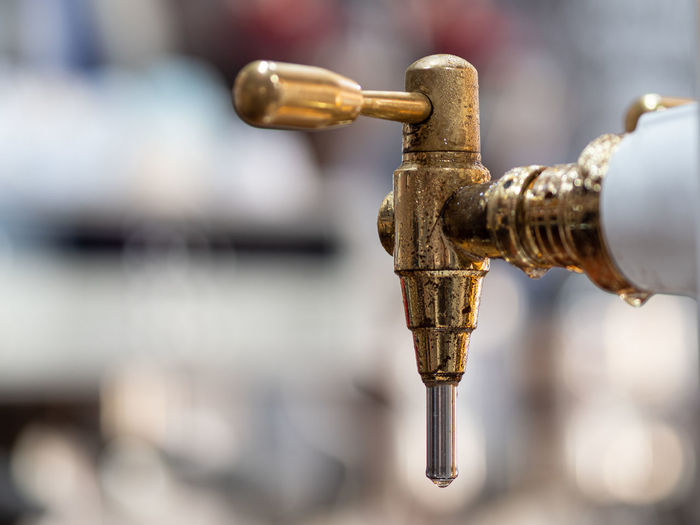 Close-up of faucet against blurred background
