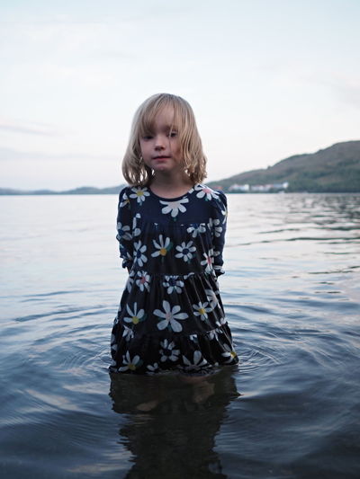 Portrait of girl standing in lake