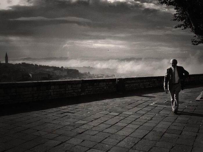 Silhouette of woman against sky