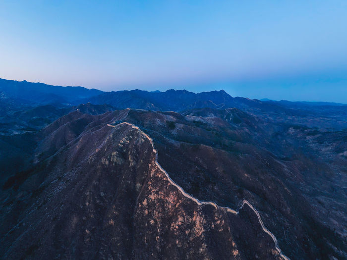 Aerial view of the great wall with mountains as a background