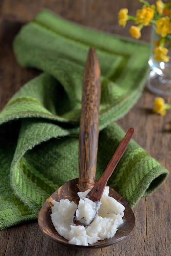 Close-up of coconut oil on wooden spoons