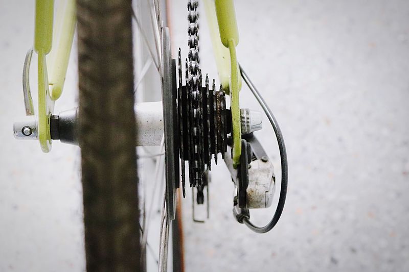 Close-up of bicycle gear on street