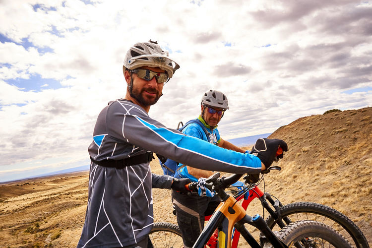 A candid portrait of two mountain bikers.