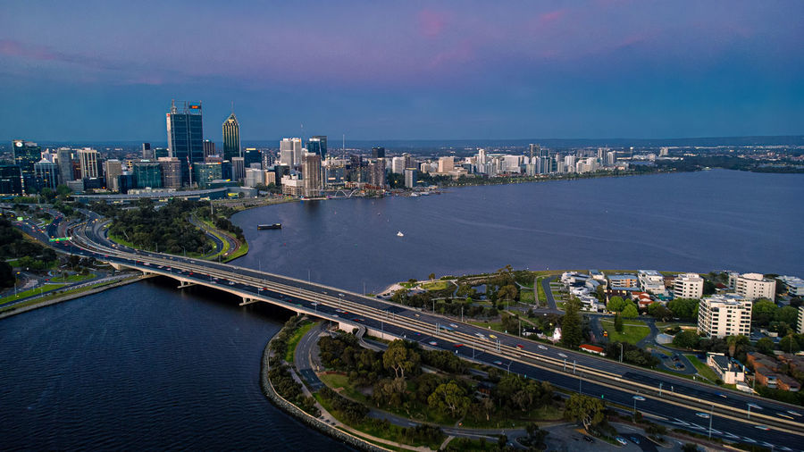 A beautiful aerial shot of perth cbd in the evening featuring a dazzling skyline in the background.