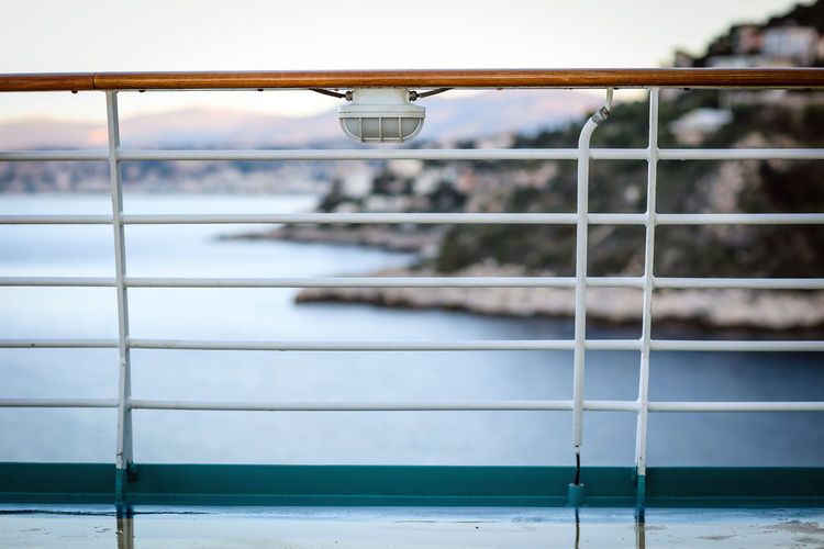 Cruise deck railing with landscape in background