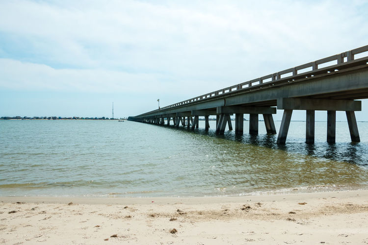 Pier over sea against sky