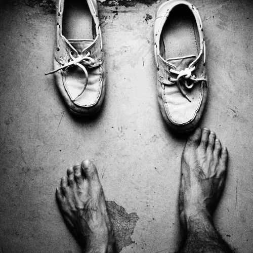 Low section of man by shoes