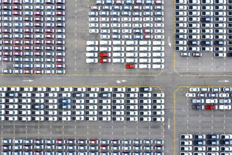 Aerial view of cars parked on road in city