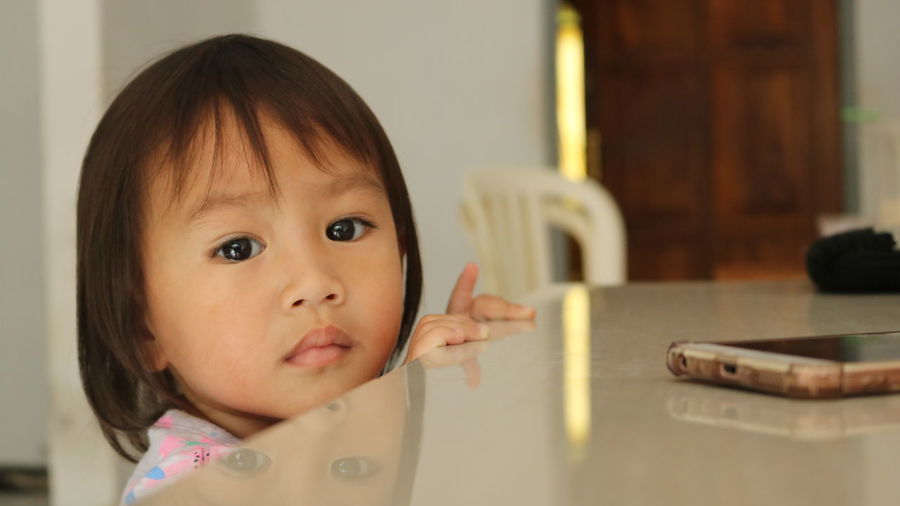 Portrait of cute girl at home